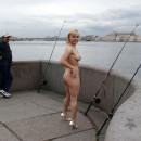 Short haired blonde with nice boobs teases fishermen at public pier