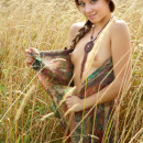 Skinny russian girl with small tits posing naked in the fields