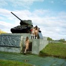 Three naked russian teens without clothes on the panzer