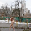 Very cute russian teen girl with tattoo walks naked at yard in Moscow