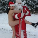Brunette with natural boobs posing with Ded Moroz at forest