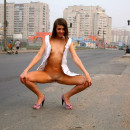 Girl with small tits and shaved pussy loves to posing at public places