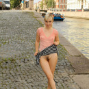 Blonde from St. Petersburg lifts up her skirt on the pier