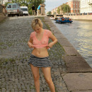 Blonde from St. Petersburg lifts up her skirt on the pier