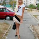 Naughty blonde with perfect body spreads her legs on the street