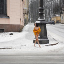 Russian brunette exhibitionist walks naked at public street at winter