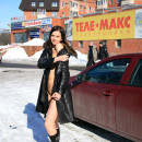 Russian brunette with small tits flashing and posing at winter sunny streets