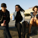 Russian girl posing naked on the pier with strangers
