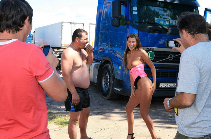 Shameless teen posing naked in front of truckers