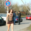 Crazy Russian beauty in a transparent top with nipples standing in a very public place