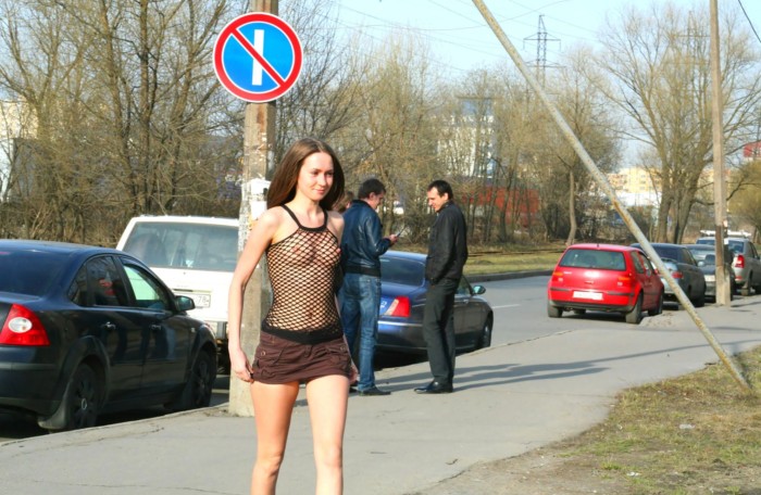 Crazy Russian beauty in a transparent top with nipples standing in a very public place