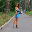 Girl walking in a dress without panties in the park