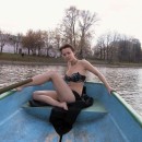Russian with cute boobs unclothes in the boat in the middle of the park