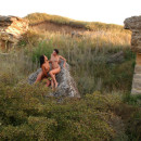 Three girls naked on the rocks