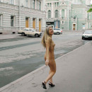 Naked girl with piercings on the streets of St. Petersburg
