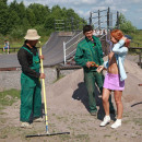 Red-haired girl gives touch her ​​tits to workers