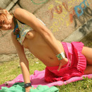 Sweet teen with perky tits takes off her bright clothes near bridge