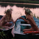 Two amateur girls with big boobs and sporty body posing in boat