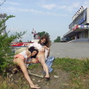 Two lesbians playing with dildo at public places