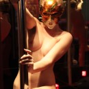 Amateur stripteaser in mask posing in sauna