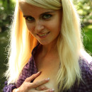Blonde with gorgeous boobs masturbates in forest