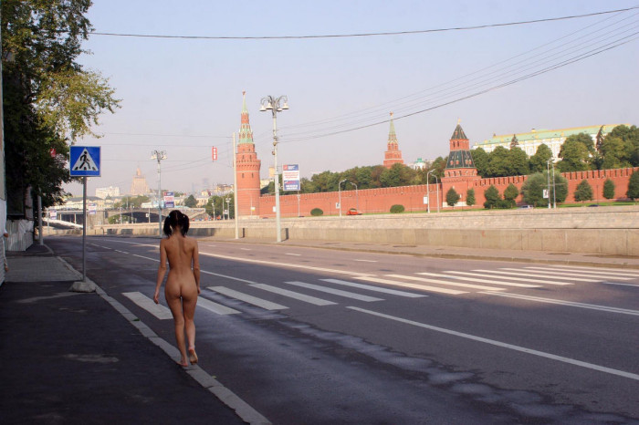 Hot russian brunette with ideal body and big boobs posing naked in front of Kremlin