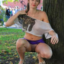 Lovely girl in short purple skirt flashes at public