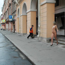 Nude blonde walking along the streets in the early morning