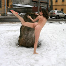 Winter photoshoot girl on the stump