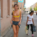 Teen girl in yellow top at public streets
