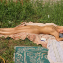 Two young girls have a picnic with no clothes