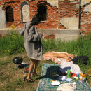 Two young girls have a picnic with no clothes