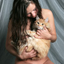 Naked busty brunette playing with red pussy