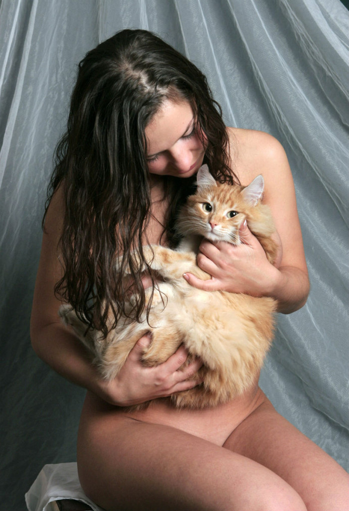 Naked busty brunette playing with red pussy