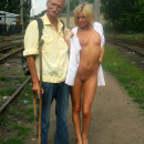 Blonde with small tits posing with old man stranger on railroad