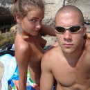 Young amateur girl resting on a nudist beach