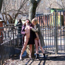 Two exhibitionists lesbians posing on public streets