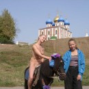 Blonde naked riding a pony near Kremlin