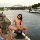 Naked girl and the photographer on the pier of the Moscow River