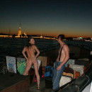 Naked guide spreads her legs in front of the captain