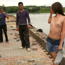 Teen titless Juliette D posing with migrant workers