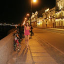Russian girl takes off a pink dress on a night promenade