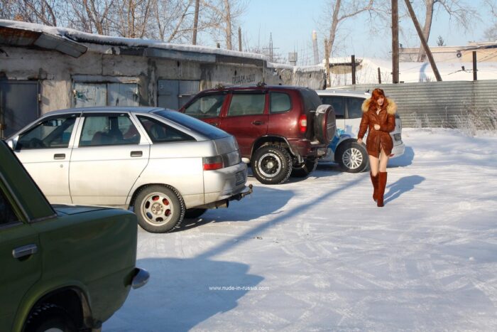 Cute russian redhead undressing at winter in garages