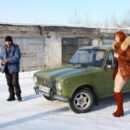Cute russian redhead undressing at winter in garages