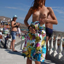 Shameless naked girl on the market in the resort town