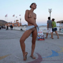 Russian pretty girl shows small suggy tits at public beach