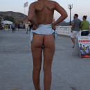 Russian pretty girl shows small suggy tits at public beach