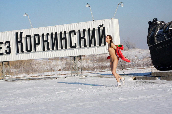 Brunette from Chelyabinsk posing at shovel monument