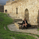 Flat-chested girl flashes at Genoese fortress