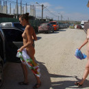 Two shameless girls undress in resort town in Cremea